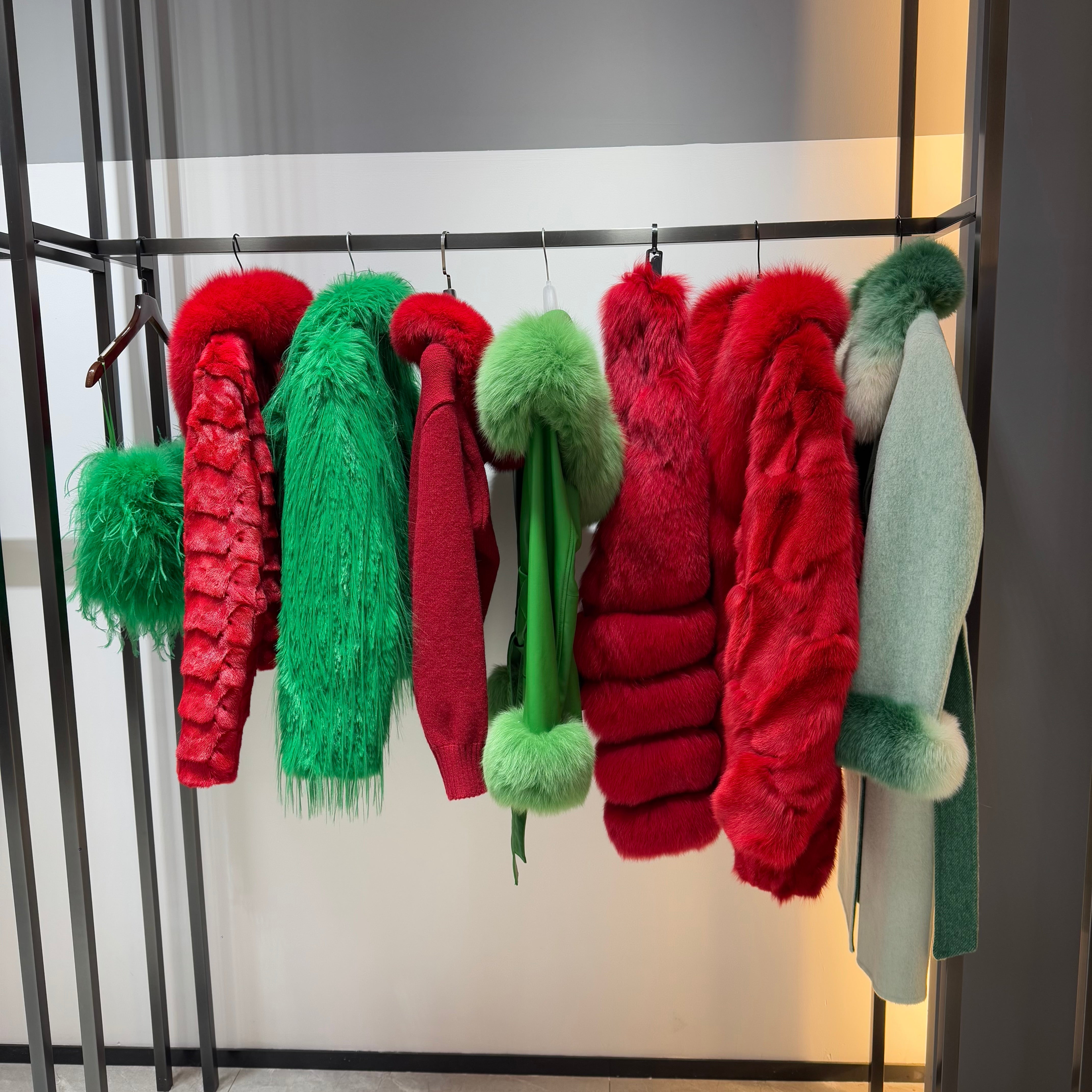 Janefur Christmas collection featuring red and green fur coats and scarves